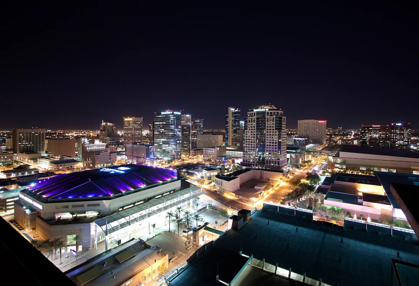 Downtown Phoenix at night, office towers lit, seen from above