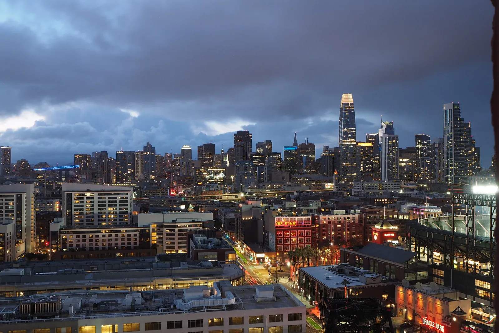 The San Francisco skyline at dusk, office towers lit